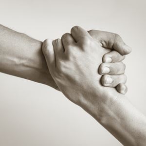 Two hands clasped together