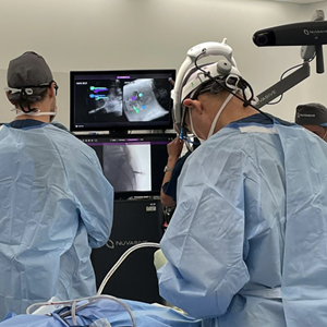 Dr Mark Winder operating with NuVasive Pulse technology