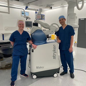 Mako Robot in operating theatre with Dr Yeoh and Clinical Nurse