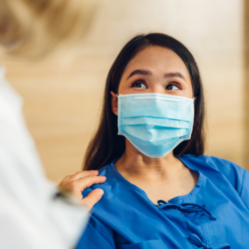 Female patient wearing mask with Doctor
