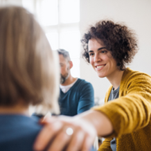 Woman specialist support patient with hand on shoulder