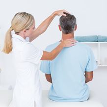 A doctor conducts a head & neck examination