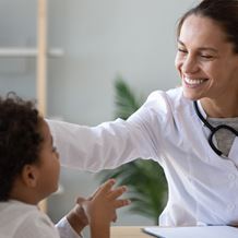 Doctor with paediatric patient